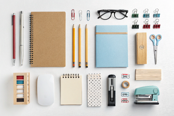 Various everyday office supplies arranged neatly